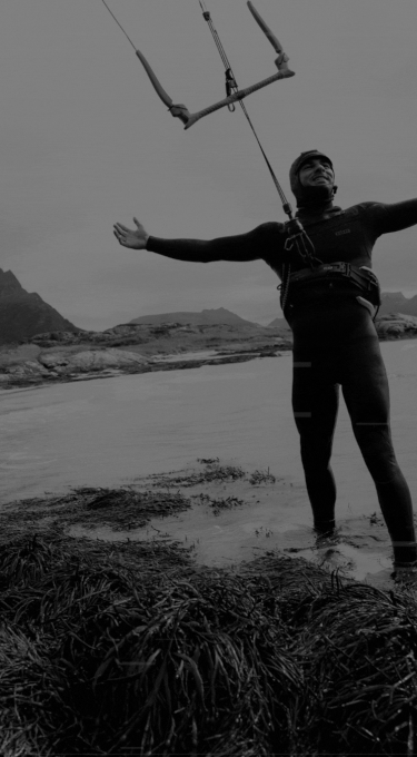 Black and white image of a kiteboarder with glitch effect overlay
