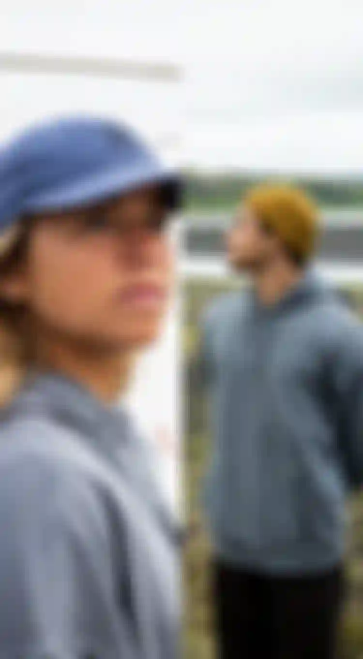 Side-by-side images: A woman in a blue cap looking up, and a man in a yellow beanie looking to the side, both in outdoor settings.