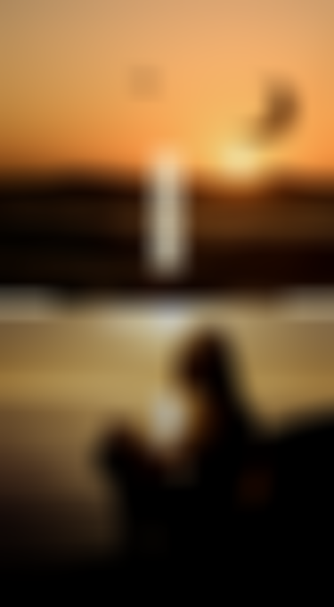Sunset with a kitesurfer in mid-air above the ocean and "DEALS" text overlay, and a silhouette of a person sitting by the sea.
