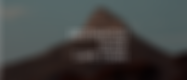 Mountain peak under a cloudy sky with the text "Destination Guide Cape Town" in the center.