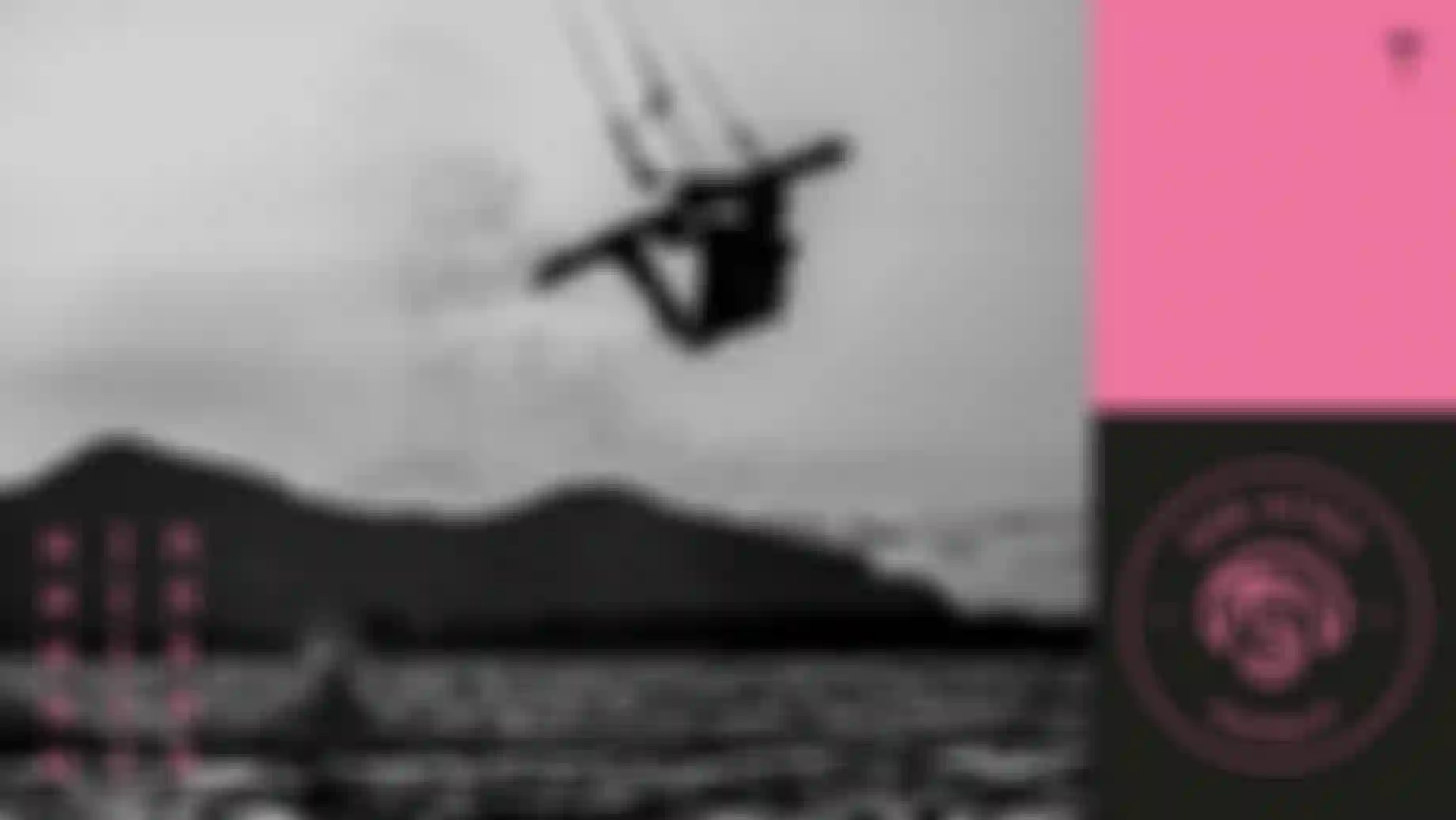 Silhouette of a person kitesurfing mid-air against a mountain backdrop. "SHE KITES AUSTRALIA" logo and "WIN" text on the sides.