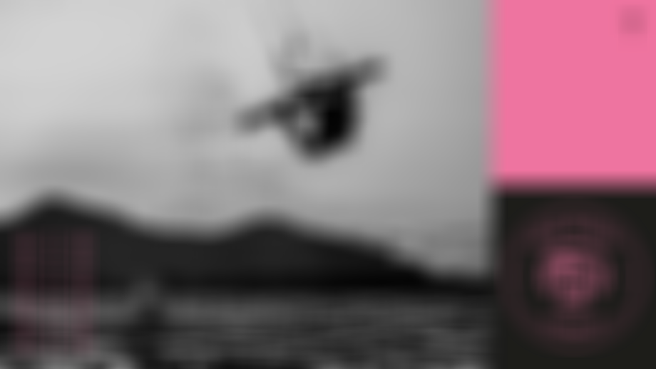 Silhouette of a person kitesurfing mid-air against a mountain backdrop. "SHE KITES AUSTRALIA" logo and "WIN" text on the sides.