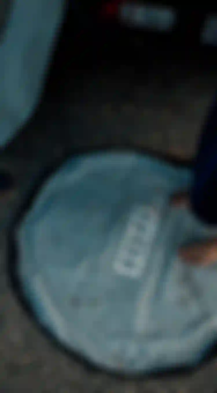 Person standing on a changing mat with ION logo