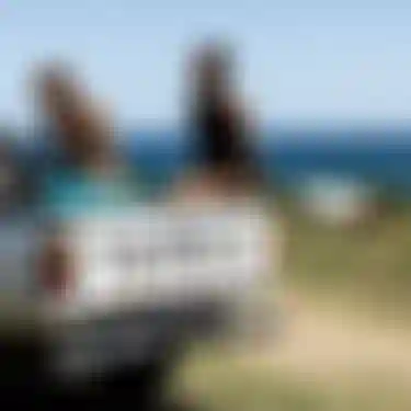 ION athletes Mo Chauvin and Leo Etienne sitting on a pickup truck in front of the sea in Guadeloupe.