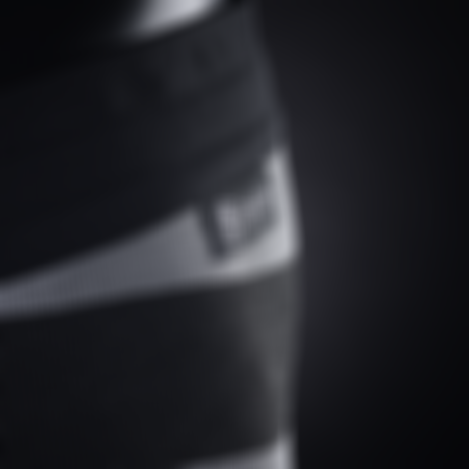 Close up of ION's cut-resistant boardshorts with black Diston label