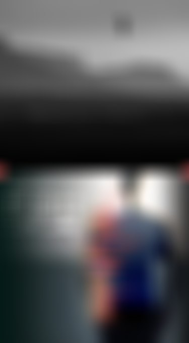 Silhouette of a kitesurfer mid-air against mountainous coastline backdrop, next to a digital graphic of a vest with technological icons.