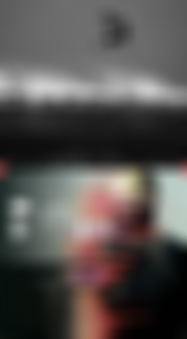 Black and white image of a wing foiler jumping above a breaking wave, on the right side backside view of a person wearing a yellow helmet with technical icons as overlay