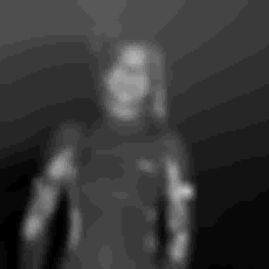 Black and white image of a woman in a wetsuit