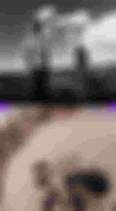 Two split image with a printed t-shirt on the bottom and two people standing side by side on a rocky cliff near the ocean on the top