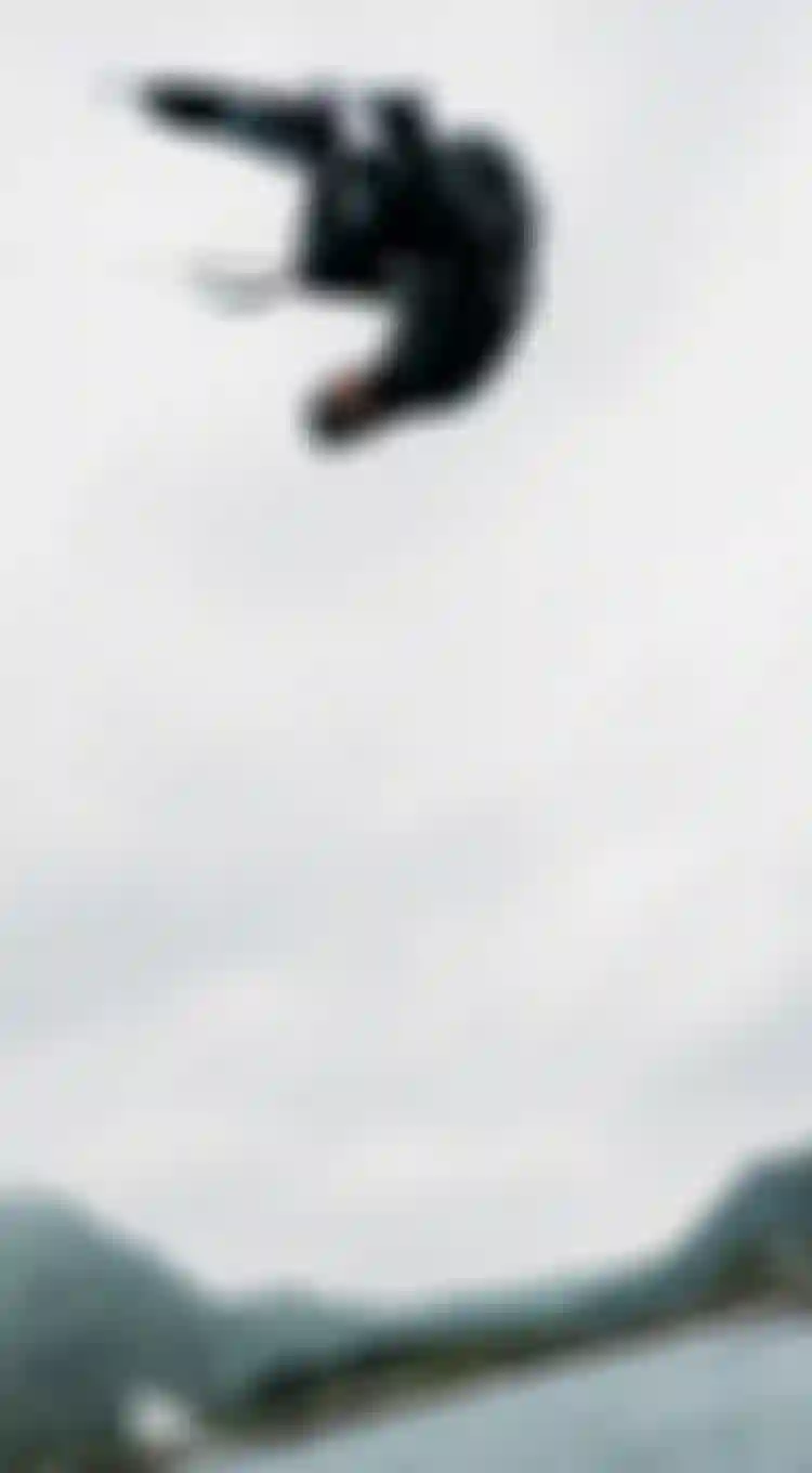 kiteboarder in the air upside down