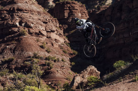 ION K-Pact Zip knee pads during mountain biking in rocky desert canyon