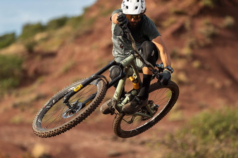 ION Bike K-Sleeve Amp knee pads during mountain biking on red rock trail terrain
