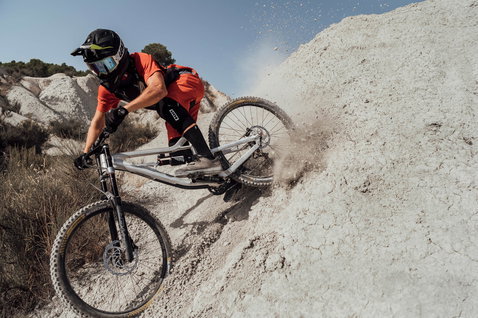 ION Scrub Select flat pedal bike shoes during mountain biking on a dusty trail
