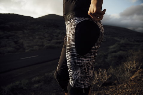 ION Bike Protection Short Scrub AMP impact shorts with SAS-TEC thigh pad in black and white during mountain biking