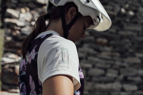 ION Scrub SS women cycling jersey in white and floral purple print during mountain biking