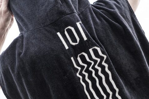 ION Core unisex surf poncho in charcoal black with ION logo print on back panel