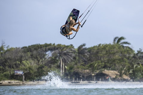 ION Nova waist harness during kitesurfing freestyle aerial over tropical water