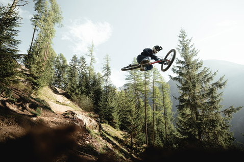 ION Bike Scrub Amp fullface helmet during mountain biking in a mountain forest