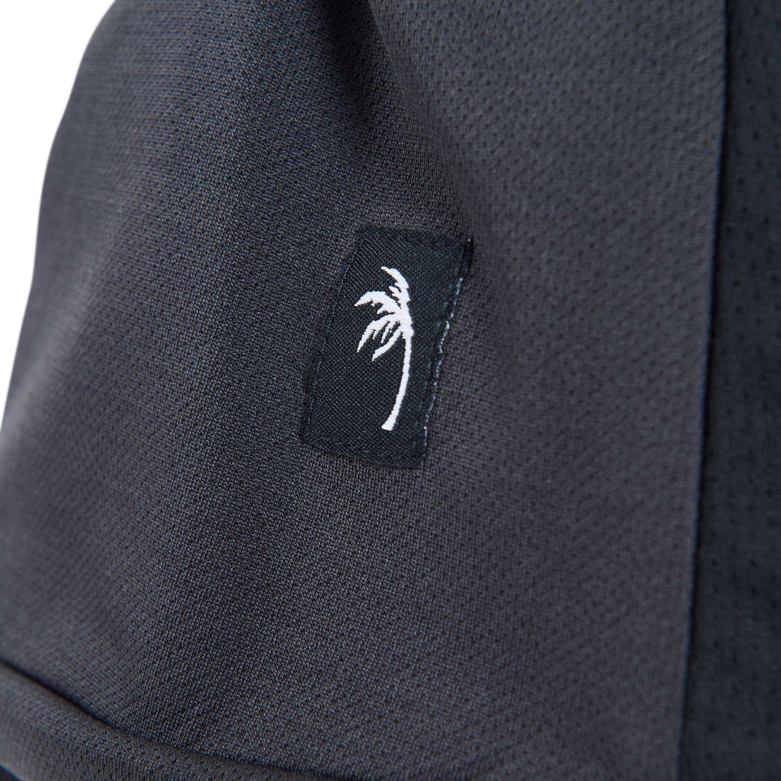 ION Bike Scrub Amp SS Damen Cycling-Jersey in anthrazit – Detailaufnahme Mesh-Panel und Logo