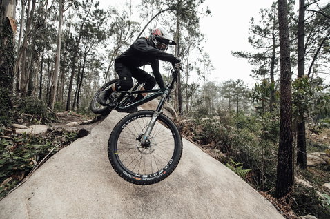 ION Bike K-Lite knee pads during mountain biking on a forest trail