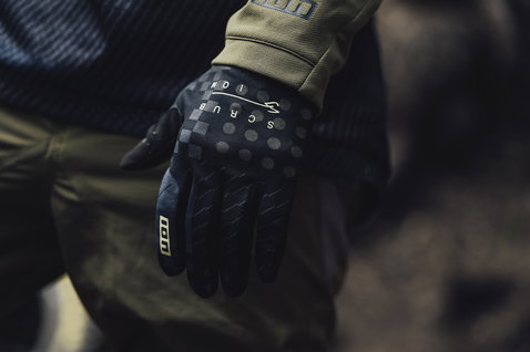 ION Scrub full-finger bike gloves in black with olive cuff during mountain biking