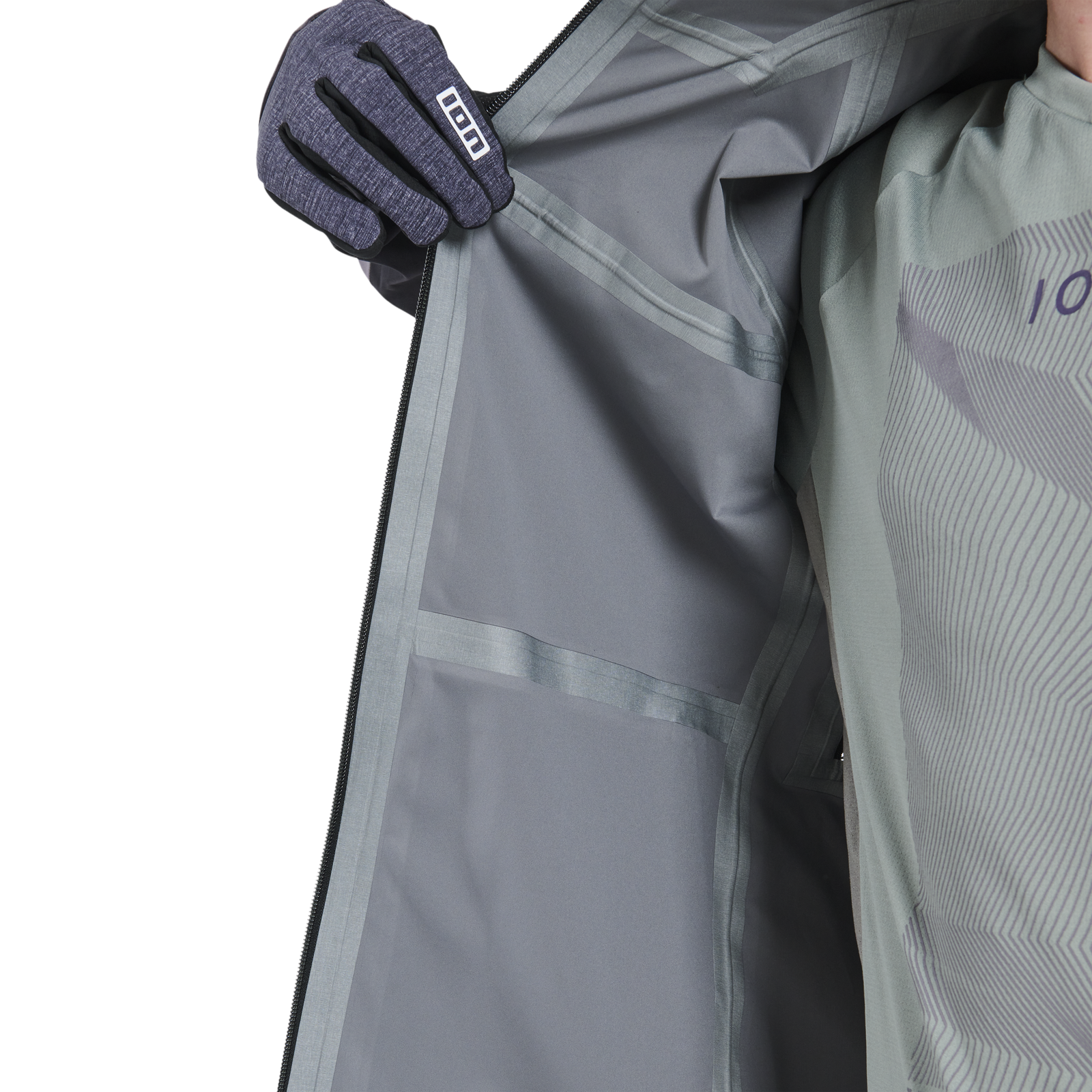 ION Shelter 3L men's hardshell MTB jacket in dark charcoal – interior detail showing taped seams