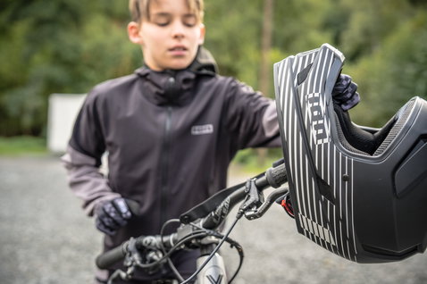 ION Scrub Amp fullface helmet for enduro and downhill mountain biking in matte black with white stripe graphics