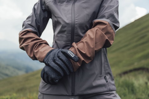 ION Bike Shelter 3L women cycling jacket in charcoal and brown during mountain biking in the hills