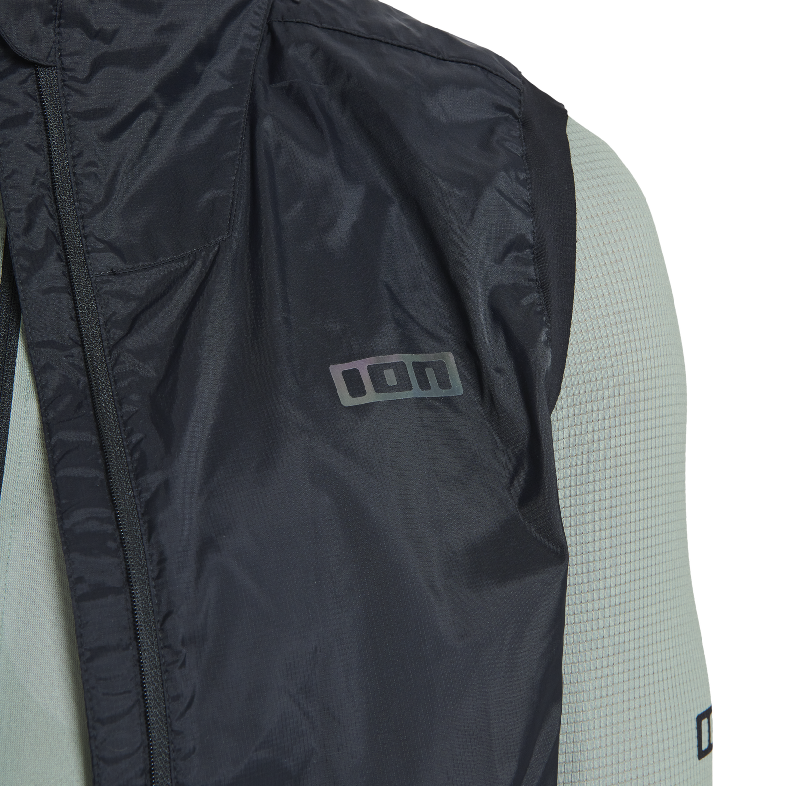 ION Shelter Lite cycling vest in black and sage green detail close-up for gravel riding