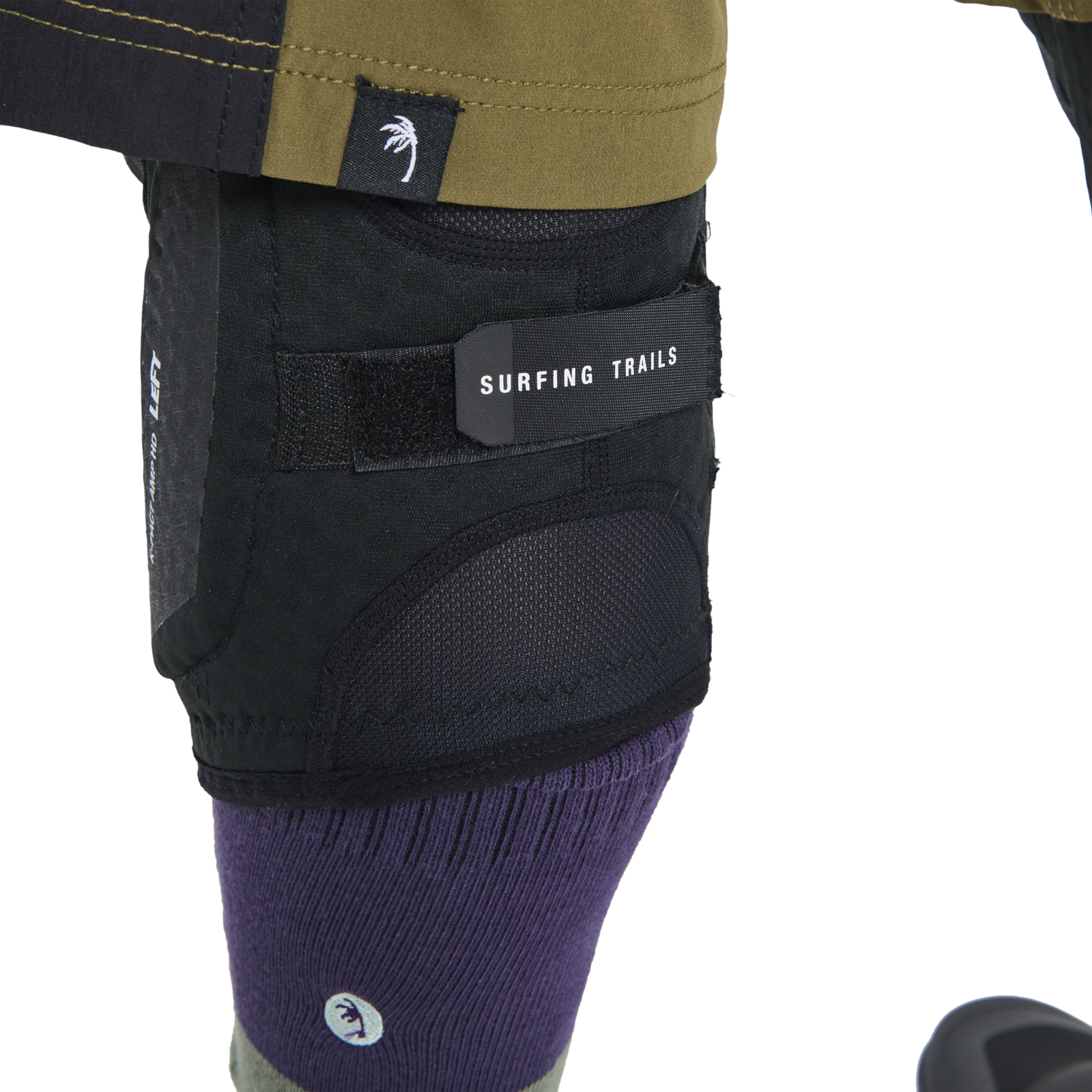 ION K-Pact Amp HD knee pads in black with SAS-TEC L2 impact pad worn on left leg
