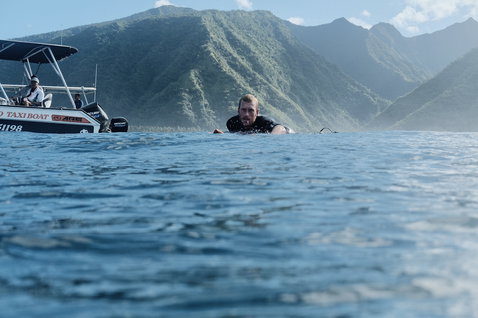 ION Element 2/2mm back-zip shorty wetsuit during wave surfing in tropical ocean waters