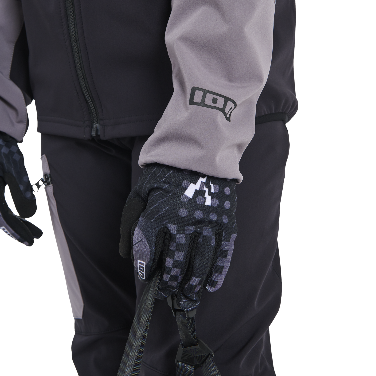 ION Shelter softshell cycling pants youth in black for mountain biking, worn with jacket and gloves