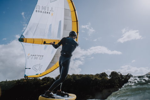 ION Arc waist harness in black during wing foiling on open water