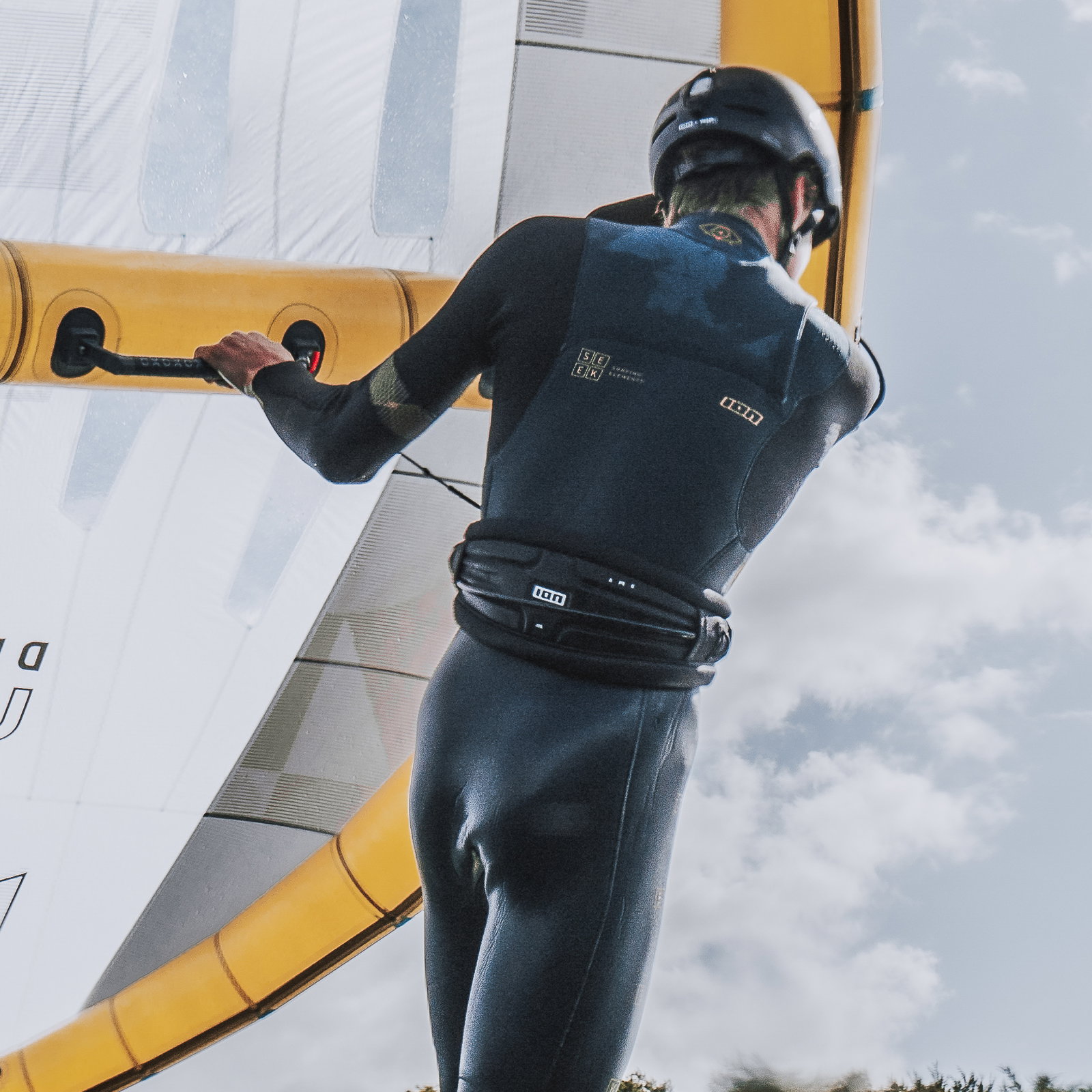 ION Arc waist harness in black during wing foiling