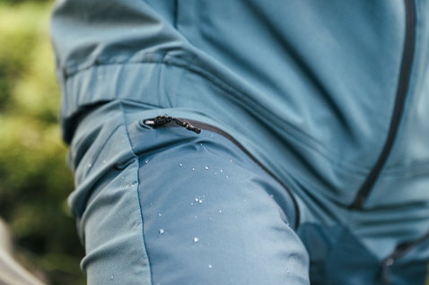 ION Shelter 3L Hybrid cycling pants in slate teal with DWR water-beading and thigh zip pocket detail
