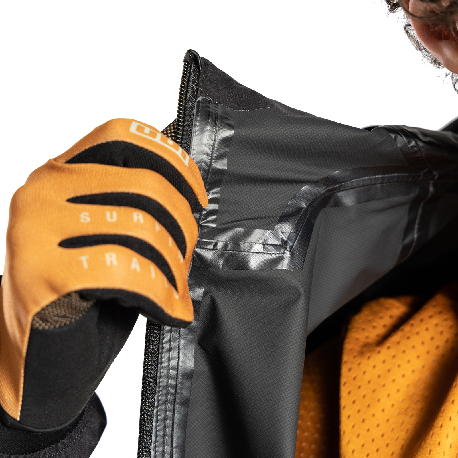 ION Bike Shelter Lite 2.5L cycling jacket in black detail view showing waterproof zipper and collar