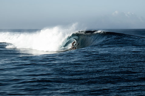 ION Surf Leash Core Ankle during wave riding inside a powerful barrel at a Tahiti reef break
