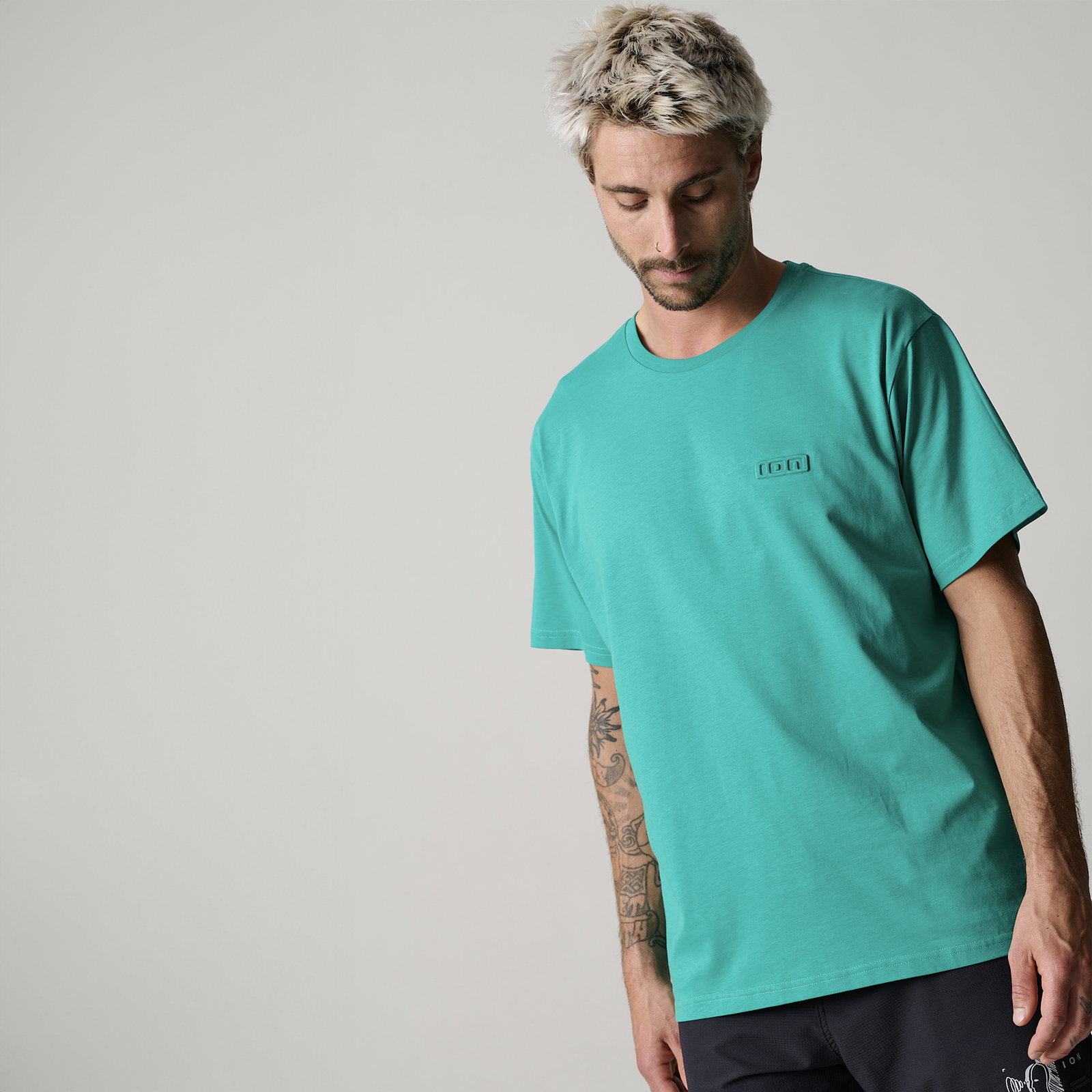 ION S-Ionic short sleeve t-shirt men in teal with embossed logo worn by male model