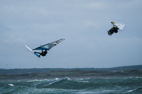 ION Plasma Boots 3/2 Round Toe neoprene boots during windsurfing on a stormy ocean