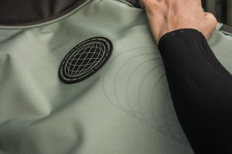 ION Core windsurf board bag in sage green, detail view with ION globe badge