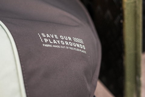 ION Windsurf Boardbag Core detail shot showing Save Our Playgrounds recycled fabric print in dark charcoal and off-white