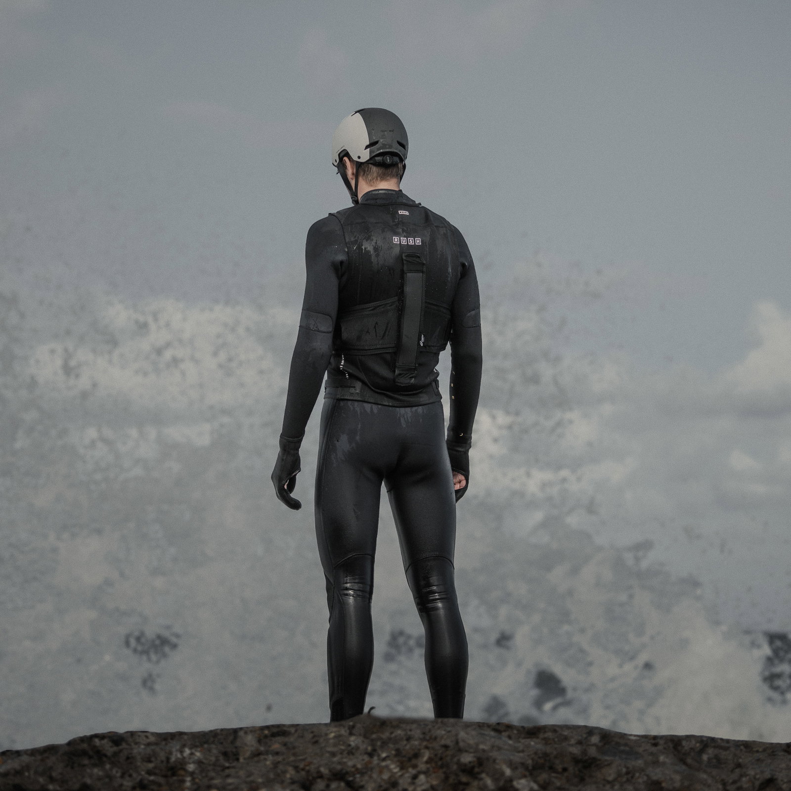 ION Rush wing vest with detachable harness and RE ZRO® back protector during wing foiling at the coast