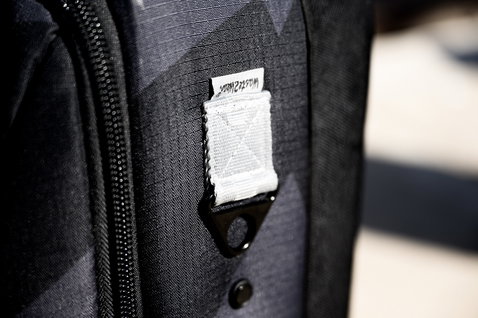 ION Carry-on Wheelie luggage zipper detail in charcoal black with recycled nylon fabric