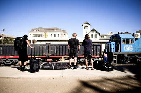 ION Carry-on Wheelie travel bag in black during travel at a train station