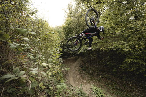 ION Bike Scrub Amp BAT long sleeve cycling jersey during freeride mountain biking in the forest