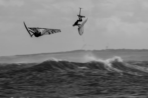 ION Vector Vest Amp front zip impact vest during wing foiling over the ocean