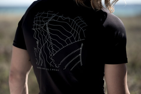 ION Water short sleeve rashguard men in black with grey back print at the coast