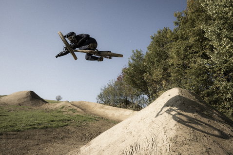 ION Ionic LT bike pants men in dark olive during mountain biking at a dirt jump park