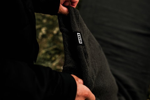 ION Wing Sock board cover 5'5" in black, detail view of fleece interior lining
