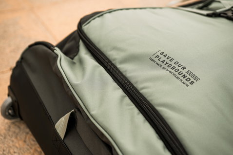 ION Gearbag Core wheeled gear bag in black and sage green – Save Our Playgrounds eco label detail